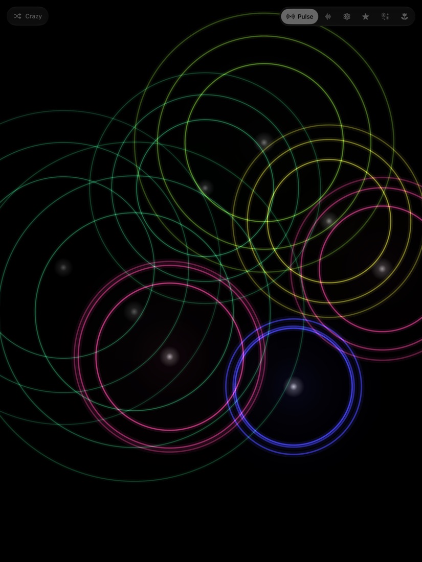 Coloured rings spreading across a black screen